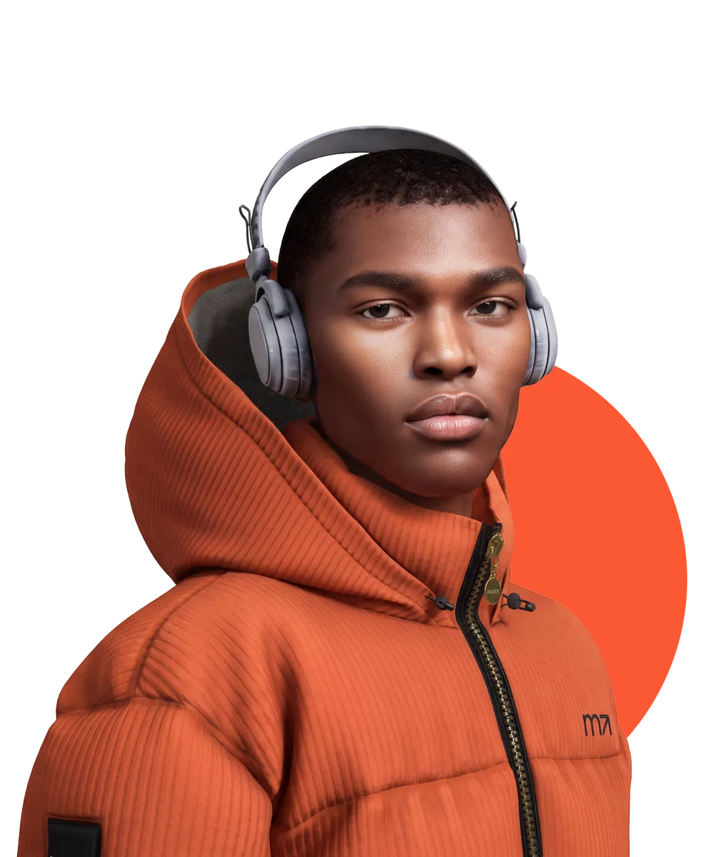 A LeLutka Evolution mesh head, three-quarter view, wearing headphones and a coral puffer jacket. A coral shape sits behind the figure.